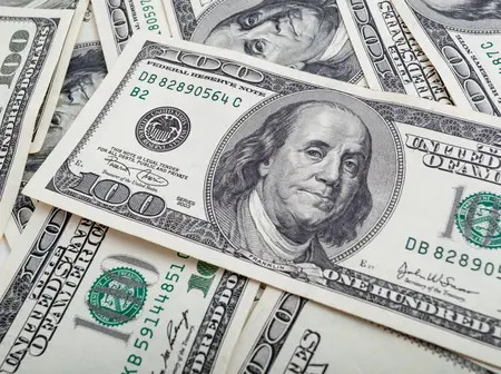 US Dollar Rises Slightly as Investors Wait for Fed Decision